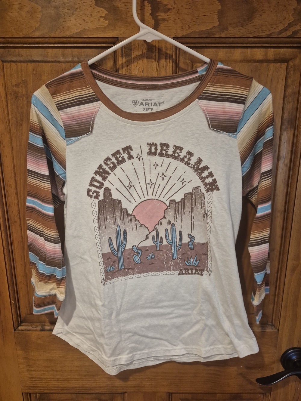 Ariat Cream Raglan Tee with Brown and Blue Desert Stripe Sleeves